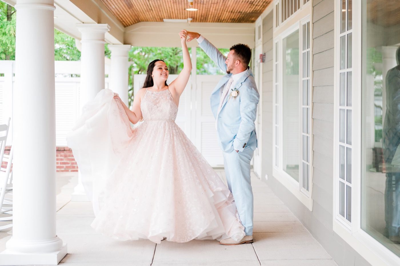 Chesapeake Bay Beach Club Wedding photos, twirl on porch of Beach Ballroom, CBBC, Rainy wedding inspiration