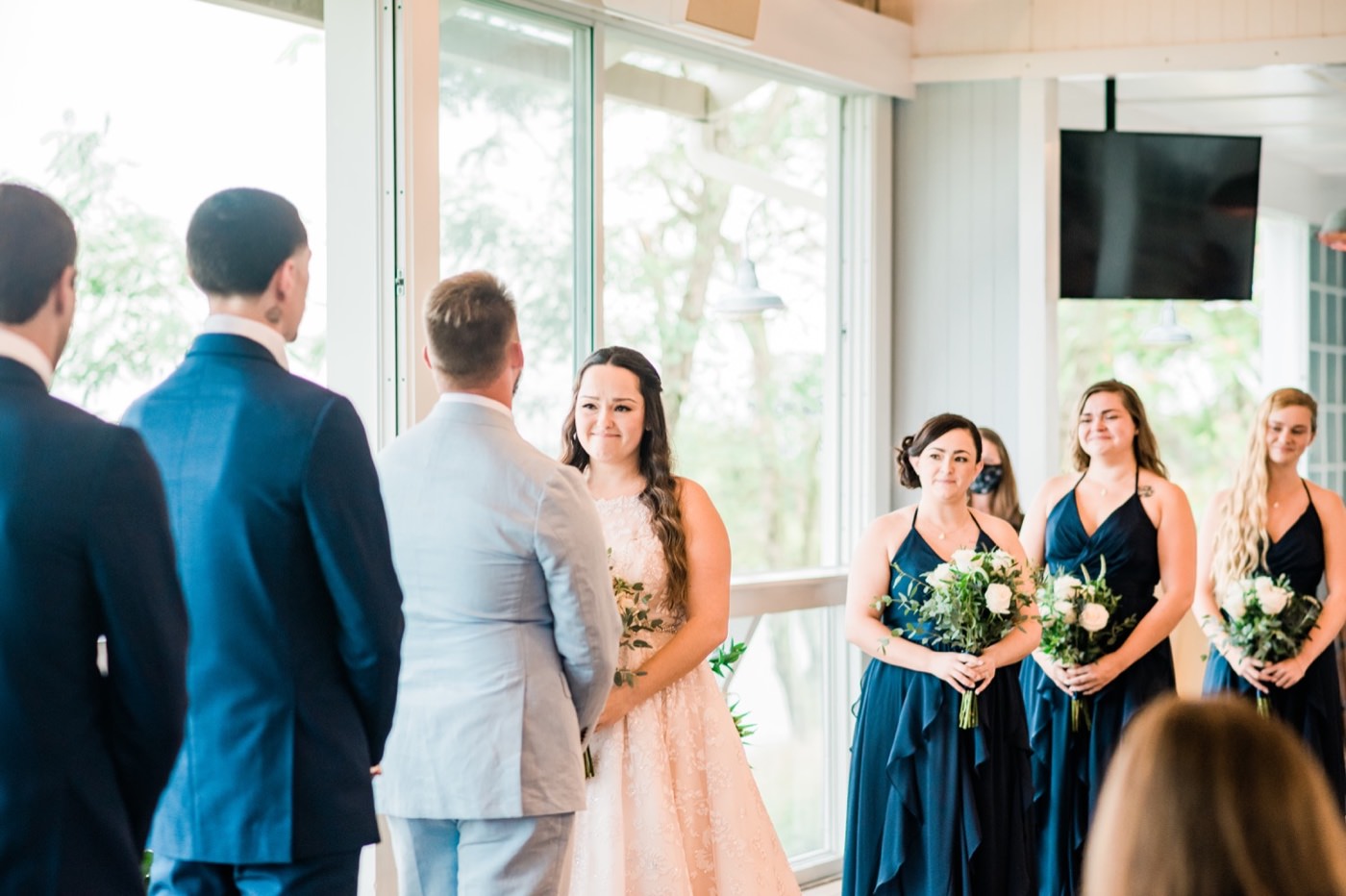 Chesapeake Bay Beach Club Wedding photos, bride reacts to vows, CBBC, Rainy wedding inspiration